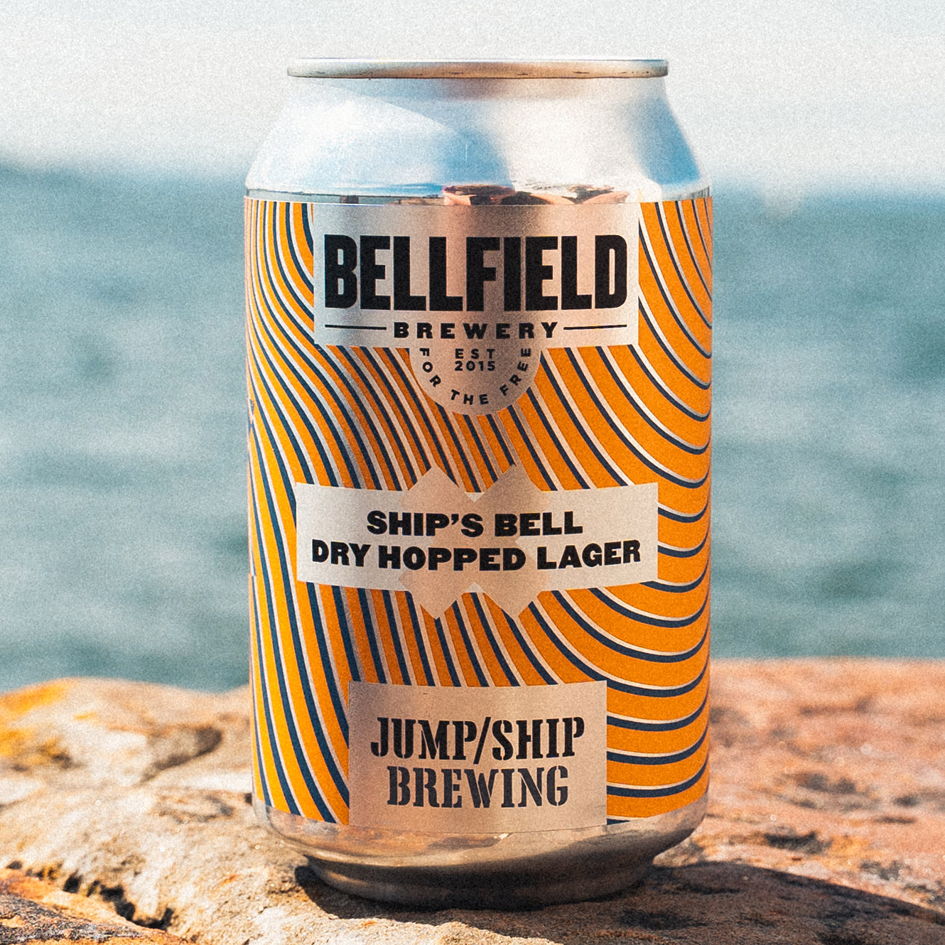 A 330ml can of Ship's Bell Dry Hopped Lager.