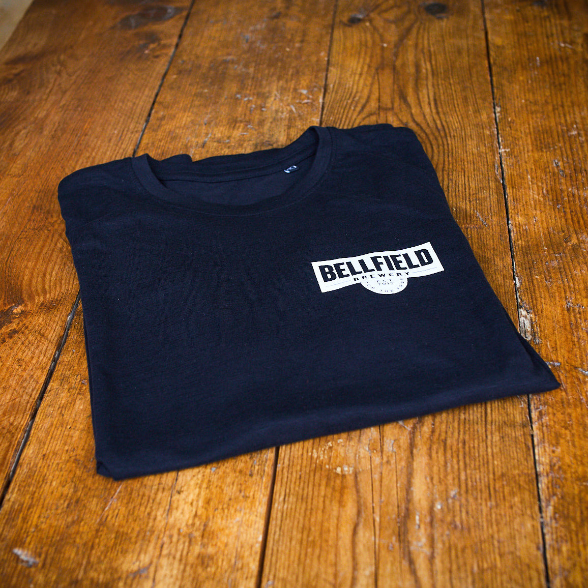 Folded black and white Belfield Short Sleeve t-shirt.