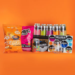 A gift box selection of hoppy beers with snacks and merch.